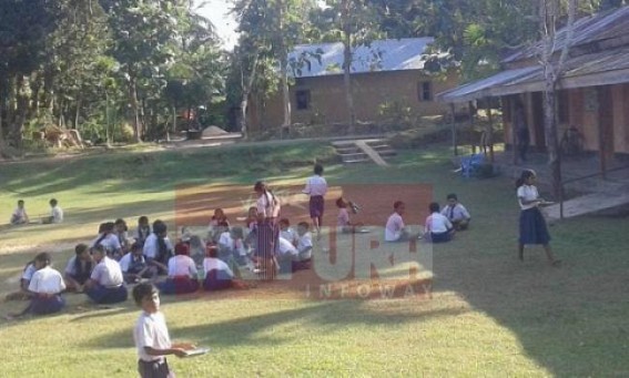 Sabroom : Students taking Mid day meal in open air 